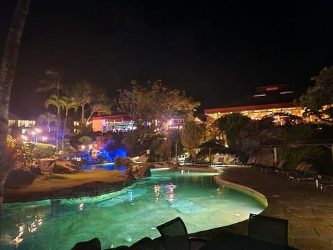 Night view of pool and Happy Talk Lounge and Wiki Pizza (2 onsite restaurants).