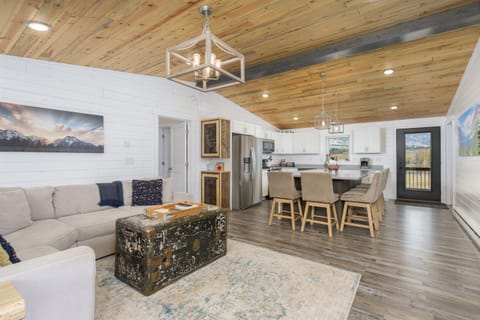 The Great Room includes the kitchen, dining area with island and living room with TV