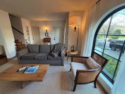 Light filled living room with comfy sofa bed.