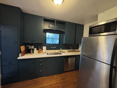 Moody blue kitchen comes with all you need to settle in. 