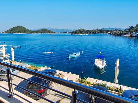 Water, Sky, Daytime, Boat, Azure, Blue, Watercraft, Lake, Coastal And Oceanic Landforms, Leisure