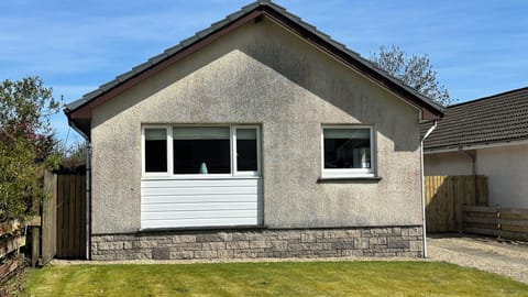 Front of house, driveway at side for off-road parking