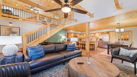 This inviting living area offers cozy seating, wooden accents, and spacious feel