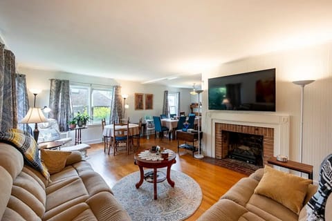 Open L-shaped living and dining area provides  space for family gatherings.
