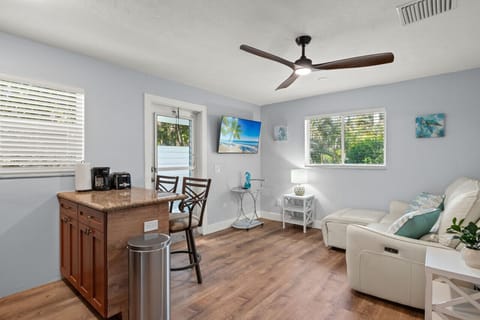 Modern lounge offering comfortable seating and a large flat-screen TV.