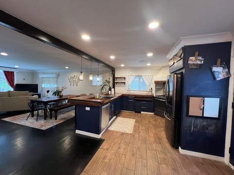 Kitchen with updated lighting - recessed and hanging pendants