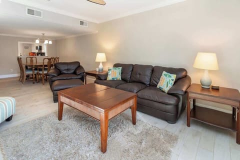 Comfortable living area with leather seating and warm lighting for relaxing evenings.