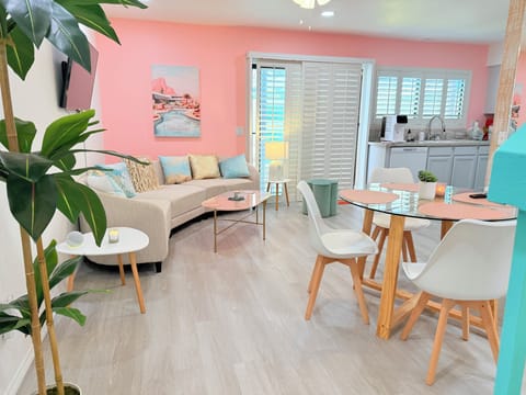 Dining room with second living room area with Smart TV on swivel mount.