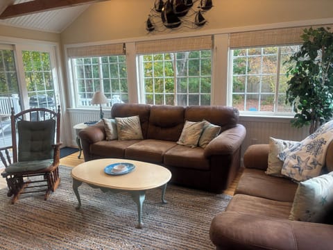 Spacious living area with TV and fireplace!