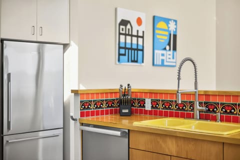 Our home’s open concept layout features a central kitchen with new appliances…