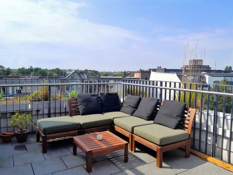Arrange the seating and lounging area on the rooftop terrace as you like.