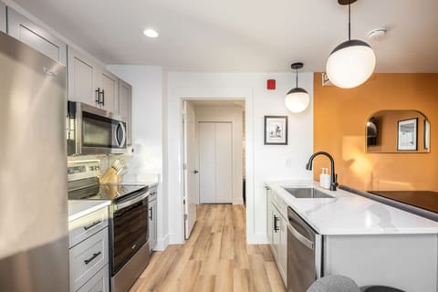 Fully-stocked, updated kitchen with all the supplies you could need to enjoy a meal at home.