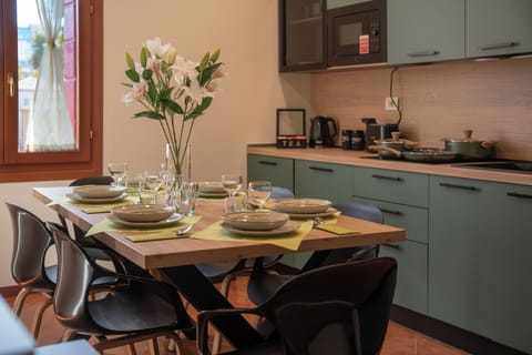 Bright kitchen with full dining setup, perfect fofr family meals