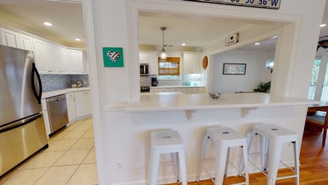 kitchen bar with seating on both sides