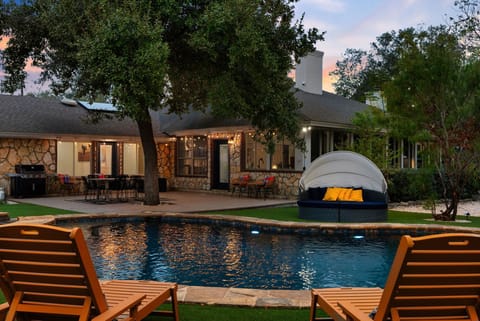 Backyard turned into a personal oasis with this stunning swimming pool. Perfect for soaking up the sun or enjoying a refreshing dip.