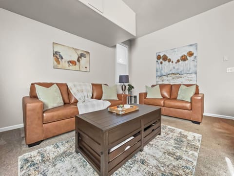 Spacious living room area with comfy furniture