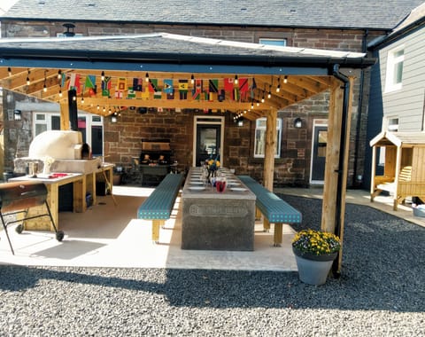 BBQ pavilion,  Wood fired pizza oven, BBQ and seating with heaters above.