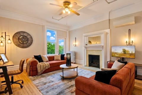 The living room flooded with natural light and rustic décor creates the perfect warm ambiance for your stay.