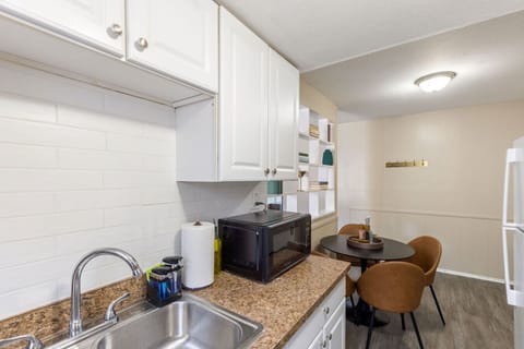 Sit down and enjoy a meal at our dining table conveniently located in the kitchen area