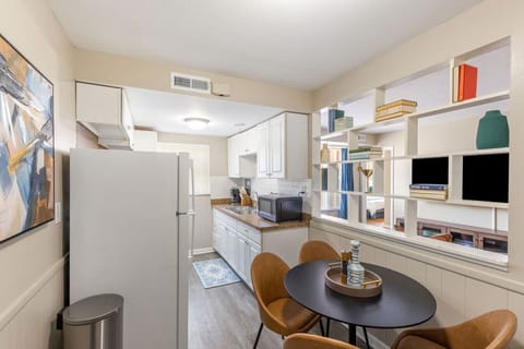 Sit down and enjoy a meal at our dining table conveniently located in the kitchen area