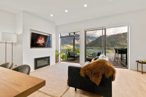 Contemporary comfort with panoramic lake and mountain views — unwind in style at your Queenstown retreat.