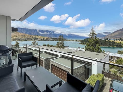 Balcony with outdoor seating and lake views