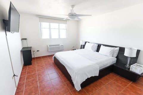 Rise to a bedroom bathed in sunlight and calm.