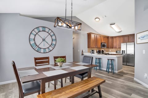 Gather around the cozy dining table or enjoy a coffee at the bar in this open, welcoming space—perfect for family meals and morning chats.