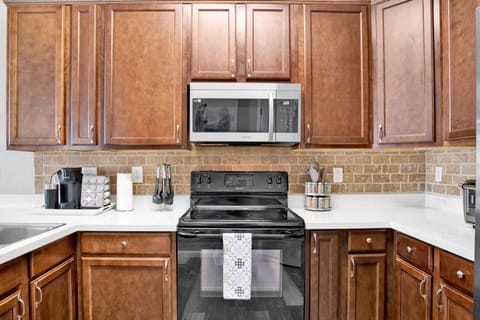 A chef’s kitchen with ample storage, top-notch appliances, and a convenient layout for cooking up family favorites