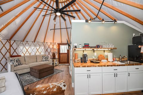 Step outside to your private outdoor oasis featuring a cozy deck, grill, and shaded seating area. Relax by the fire pit with free firewood provided. This peaceful retreat offers the perfect blend of comfort and adventure.