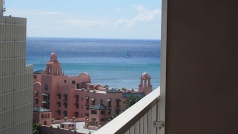 View from your lanai of the Royal Hawaiian Hotel and Waikiki Beach.