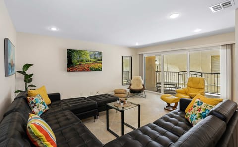 Living room with comfortable seating around a Smart TV (Netflix, Hulu, etc.)