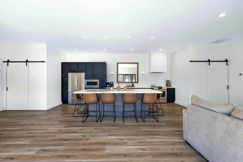 The gorgeous, updated kitchen offers ample space & all the comforts of home