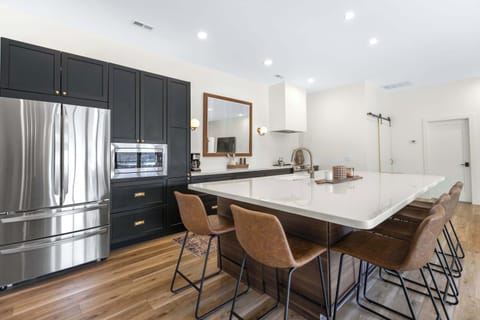 The gorgeous, updated kitchen offers ample space & all the comforts of home