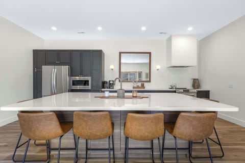 The gorgeous, updated kitchen offers ample space & all the comforts of home