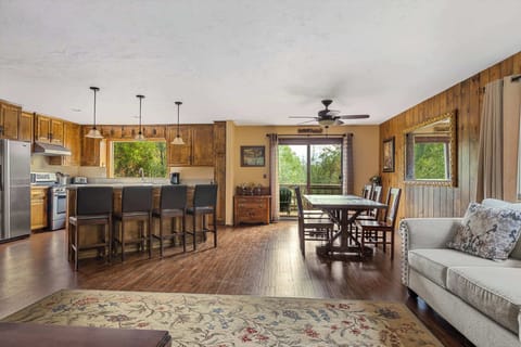 Living room opens to kitchen and dining table.