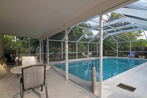 Gazebo with outdoor dining by the pool