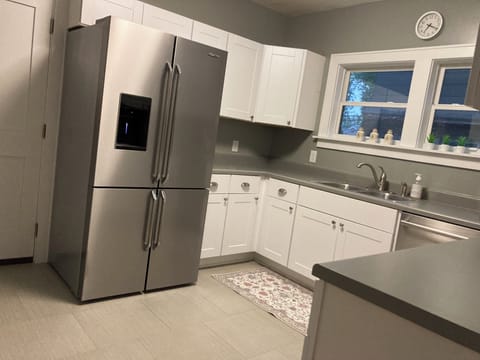 Full size refrigerator with freezer. Ice and water in door.
