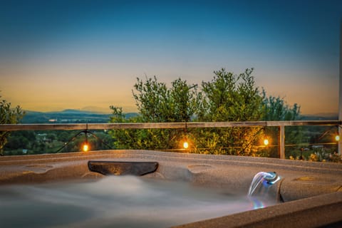 Soak in the hot tub while taking in peaceful mountain sunsets.