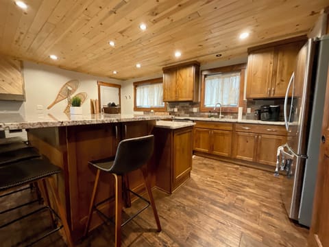 Enjoy the scenery of family and friends while cooking or lounging at the bar. 