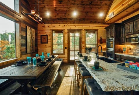 Spacious dining area with a view, perfect for gathering everyone together for meals and memories.