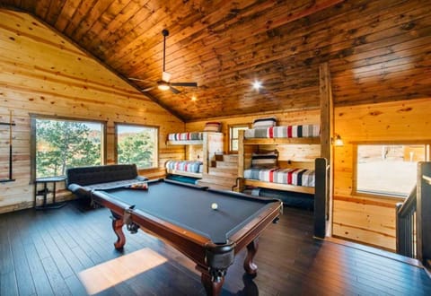 Gather around for a game in this loft, complete with a pool table and plenty of seating to kick back and relax.