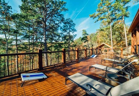 Spacious deck with lounge chairs and fresh forest views – an ideal spot for unwinding and soaking in the sunshine.