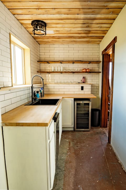 The game room is the ultimate hangout, featuring a pool table, mini bar & TV.