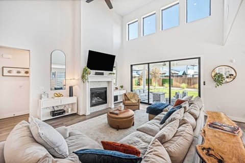 Living space with fireplace and backyard views