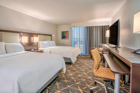 Settle into crisp linens and enjoy space to truly relax.