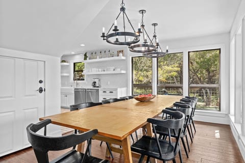 Dine together at the oversized table, surrounded by natural light from large windows. This space makes every meal feel special.
