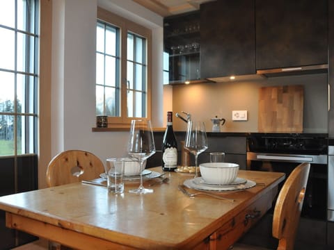 Furniture, Interior Design, Kitchen, Countertop, Flooring, Cabinetry, Wood, Chair, Kitchen Appliance, Ceiling