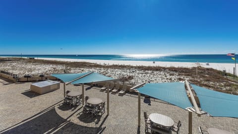 Enjoy the spacious outdoor pool area with shaded seating and views of the tranquil waters and inviting lounging spaces