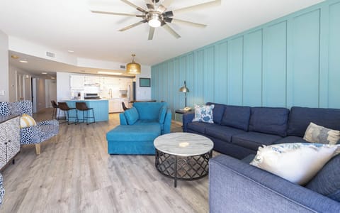 Relax in the inviting living area, featuring a sofa with queen sleeper and easy access to the dining space and kitchen